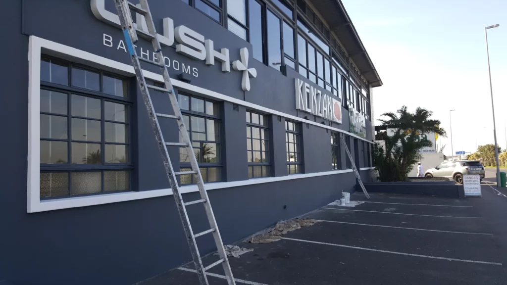 Waterproofing and painting contractors working on a commercial building in Cape Town