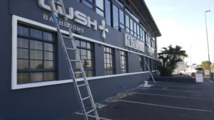Waterproofing and painting contractors working on a commercial building in Cape Town